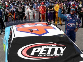 NASCAR drivers stand in solidarity with Bubba Wallace, driver of the #43 Victory Junction Chevrolet, during pre-race ceremonies prior to the NASCAR Cup Series GEICO 500 at Talladega Superspeedway on June 22, 2020 in Talladega, Ala.