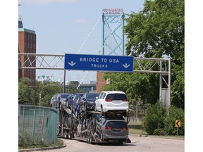 Though the border between Canada and the U.S. will remain closed to non-essential traffic, there was plenty of truck traffic heading to the international border crossing at the Ambassador Bridge in Windsor Tuesday. In photo, Windsor-built Chrysler Pacificas head to the U.S. market.