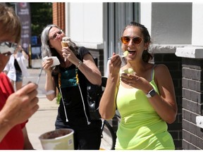 Sandra Davidovic, right, and co-worker Wendy Wittine, behind left, enjoy delicious ice cream while visiting Artesano Cafe on St. Rose Avenue at Wyandotte Street East Thursday. The Riverside neighbourhood cafe and ice cream business opened at the beginning of 2020 and made it through the pandemic to reopen to a steady clientele.  Artesano's owner Alejandro Diaz and his family offer a variety of teas and coffee, soups, wraps,  burritos and ice cream.