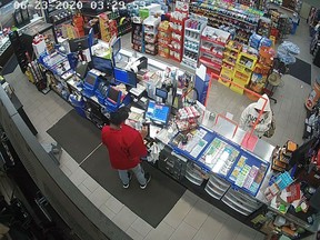 Essex County OPP have released photos of a masked woman who robbed a Leamington convenience store on June 23.