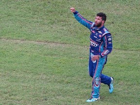 NASCAR Cup Series driver Bubba Wallace waves to fans after competing in the Geico 500 at Talladega Superspeedway, June 22, 2020 in Talledega Ala.