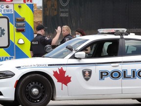 Windsor Police officers investigate a two-vehicle collision on Huron Church Road Tuesday.