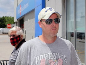 Jared Brown, 40, is not that concerned about possibly being infected while not wearing a protective mask Tuesday.