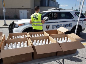 City of Windsor and Laser Transport staffers handed out 5,000 375ml bottles of hand sanitizer at the WFCU Centre on Friday, June 12, 2020.
