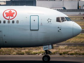 (FILES) In this file photo taken on May 20, 2020, an Air Canada plane prepares to take off at the Benito Juarez International airport, in Mexico City, amid the new Covid-19 coronavirus pandemic. - Air Canada raised nearly Can$1.6 billion (US$1.2 billion) from the issue of new stocks and debt in order to keep flying through the pandemic, the nation's flagship carrier announced on June 2, 2020.