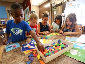 FILE PHOTO: Registered Early Childhood Educator Alexandra DeCaro, centre works with children at the ABC Day Nursery of Windsor on Hanna St. East in Windsor, Ontario.