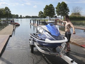 Nick Cmarada is shown June 18, 2020, launching his watercraft at the recently re-opened boat ramp at the LaSalle Marina. User fees resume on Monday.
