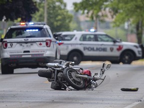 Windsor police investigate a collision between a motorcycle and a car at the intersection of West Grand Boulevard and Avondale Avenue, Wednesday, June 10, 2020.