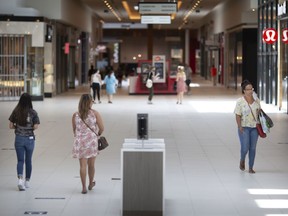 Shoppers browse through Devonshire Mall on the first day of being reopened since the start of the COVID-19 pandemic, Thursday, June 25, 2020.