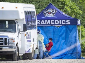 A mobile testing unit run by Essex-Windsor EMS visits a Kingsville farm on June 18, 2020. The federal and provincial governments only recently announced stepped-up testing, monitoring and inspections and assistance to local health authorities coping with COVID-19 outbreaks at farms in Kingsville and Leamington.