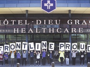Unionized and management staff at Hôtel-Dieu Grace Healthcare in Windsor held a demonstration on Thursday, June 11, 2020, to send a message to Ontario Premier Doug Ford that all frontline workers should qualify for the pandemic pay increase. They are shown during the noon hour event.
