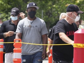 Shoppers wearing protective masks enter the Costco store in Windsor on Monday, June 22, 2020.