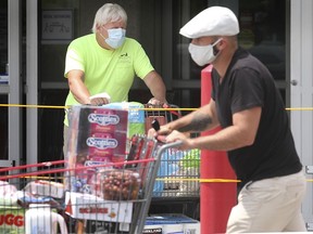 Shoppers wear face masks at Costco in Windsor on June 22, 2020.
