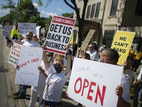 People demanding Windsor and Essex County move to Stage 2, protest outside the Windsor-Essex County Health Unit, Wednesday, June 24, 2020.