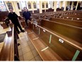 Rev. Mark Poulin, left, and Rev. Paul Kim are shown at St. Anne Catholic Church in Tecumseh, ON. on Thursday, June 18, 2020. The parish has resumed mass services with limited attendance and visual markings to encourage social distancing.