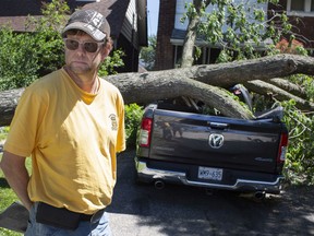 Graham Sutherland inspects the damage to his Ram Bighorn outside his home on the 1500 block of Victoria Avenue, Thursday, June 11, 2020, after severe storms passed through the region the previous evening.