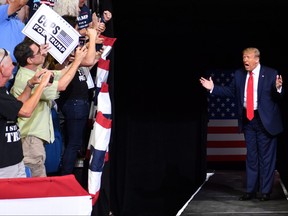 In this file photo, U.S .President Donald Trump arrives for a campaign rally at the BOK Center on June 20, 2020 in Tulsa, Okla.