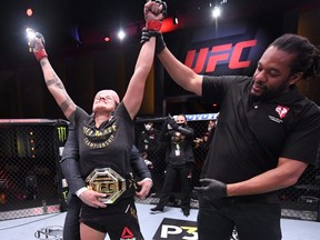 Amanda Nunes of Brazil celebrates after her unanimous-decision victory over Felicia Spencer of Canada in their UFC featherweight championship bout during UFC 250 at the UFC APEX.