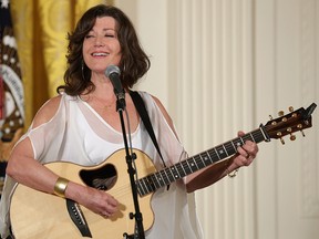 Christian singer-songwriter Amy Grant performs during an Easter Prayer Breakfast in the East Room of the White House April 7, 2015, in Washington, D.C.