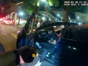 Still frame from Atlanta Police Department bodycam video footage of police officer Ivory Streeter, shows car driver Messiah Young being shot by a taser, during ongoing protests against the death in Minneapolis police custody of George Floyd, in Atlanta, May 30, 2020.