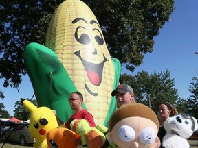 Workers with All-Canadian Entertainment gather plush toy prizes in preparation for the 2019 edition of the Tecumseh Corn Festival on Aug. 22, 2019.