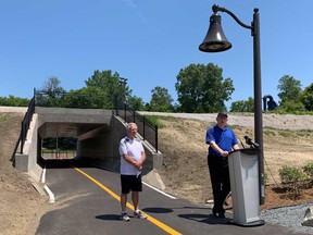 Ward 10 Coun. Jim Morrison (left) and Mayor Drew Dilkens (right) announce the opening of the cyclist and pedestrian underpass at Dougall Avenue in south Windsor on June 16, 2020.