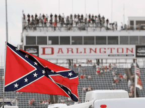 A Confederate flag flies in the infield before a NASCAR Xfinity auto race at Darlington Raceway in Darlington, S.C., Sept. 5, 2015.