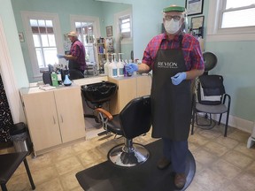 Jonscot Gibbons, owner of Salon Classique is shown at his Windsor business on Thursday, June 25, 2020 wearing personal protective equipment necessary for cutting hair under provincial regulations.