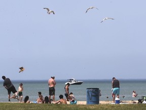 People cool down at the Lakeview Park West Beach in Lakeshore on Tuesday, June 9, 2020.