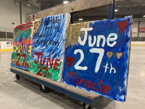 Hand-pointed signs promoting the June 27 Miracle food drive in Windsor-Essex, photographed at the WFCU Centre on June 23, 2020.