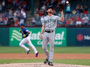 Mike Leake of the Seattle Mariners reacts after giving up a solo home to Asdrubal Cabrera of the Texas Rangers at Globe Life Park in Arlington on May 20, 2019 in Arlington.