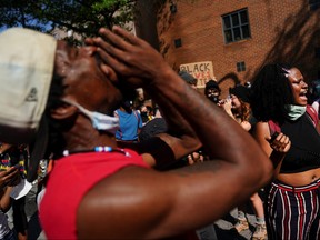 Protesters rally against racial inequality and the police shooting death of Rayshard Brooks, in Atlanta, Georgia, U.S. June 13, 2020.