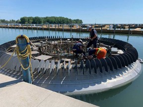 City of Windsor workers prepare the Charlie Brooks Memorial Peace Fountain for installation on June 8, 2020.