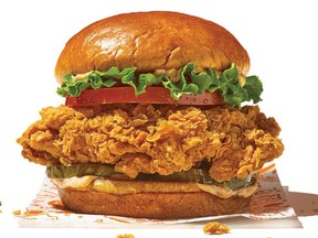 A promotional image for Popeyes Spicy Chicken Sandwich.