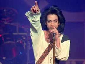 In this file photo taken on June 16, 1990 musician Prince performs on stage during his concert at the Parc des Princes stadium in Paris.