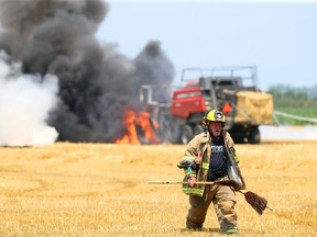Lakeshore firefighters respond to a tractor and baler fire in the middle of a large straw field on County Road 42 at Lakeshore Road 125 on Wednesday, July 8.