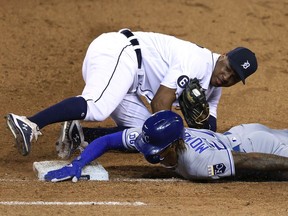 Adalberto Mondesi of the Kansas City Royals is tagged out trying to get back to first base after a dropped infield fly ball by Jonathan Schoop of the Detroit Tigers at Comerica Park on July 28, 2020 in Detroit, Michigan. Detroit won the game 4-3.