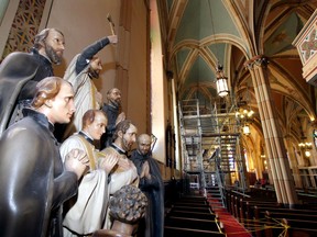 A statue of Canadian martyrs at Windsor's Assumption Church where scaffolding has been erected for Phase 2 of restoration work Friday. Plaster consolidation, paint restoraton and insulation work will continue for several months.  Pupatello and Sons Ltd. has the contract for extensive project on the historic landmark.