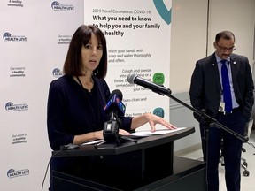 Theresa Marentette, CEO of the Windsor-Essex County Health Unit, addresses media on March 24, 2020. Medical officer of health Dr. Wajid Ahmed listens from the side.