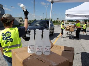 During a previous free giveaway, City of Windsor and Laser Transport staffers handed out 5,000 375ml bottles of hand sanitizer at WFCU Centre on June 12, 2020.