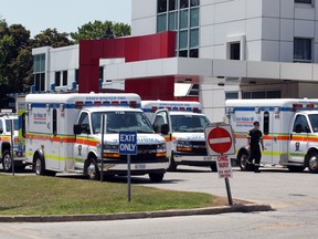 When it comes to fighting COVID-19 at local farms, who's in charge? Shown here on July 2, 2020, are Essex-Windsor EMS ambulances at Leamington's Erie Shores HealthCare.