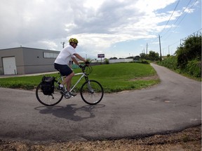 Dave Robichaud, 58, takes the new multi-use trail near Deziel Drive following his shift at FCA's Rhodes Drive facility on Wednesday, July 29, 2020.