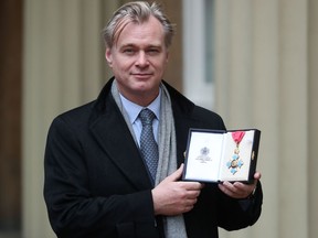 British-American director Christopher Nolan poses on Dec. 19, 2019, after he was made a Commander of the British Empire for services to film during an investiture ceremony at Buckingham Palace, London.