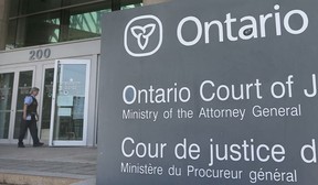 A security guard enters the Ontario Court of Justice in Windsor on July 6, 2020.