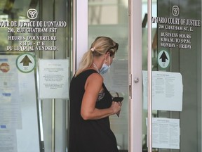 "New normal." A masked woman enters the Ontario Court of Justice on Monday, July 6, 2020, in downtown Windsor. In-person court proceedings resumed for the first time since the pandemic lockdown.