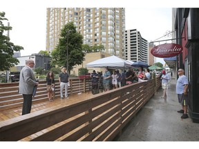 Three local restaurants are setting up outdoor eatery on Pitt St. E. in downtown Windsor. A press conference was held on Friday, July 10, 2020, to unveil the collaborative effort. The outdoor setup is shown during the event.