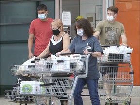 Masked shoppers leave the Zehrs store at the Parkway Plaza in Windsor on July 28, 2020.