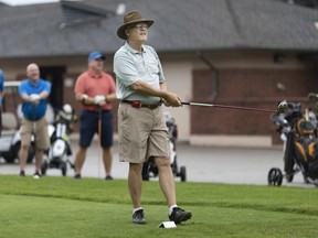 Tom Nemeth tees off on the first hole at Roseland Golf and Curling Club, while the rest of his foursome, Hank Stam, Brian Wirch, and Ray Marchand, watch his ball, Thursday, July 16, 2020.