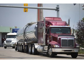 A tanker truck exits the Canadian side of the Ambassador Bridge, Wednesday, July 8, 2020.