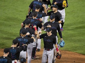 The Miami Marlins celebrate their Opening Day win against the Philadelphia Phillies at Citizens Bank Park in Philadelphia, July 24, 2020.